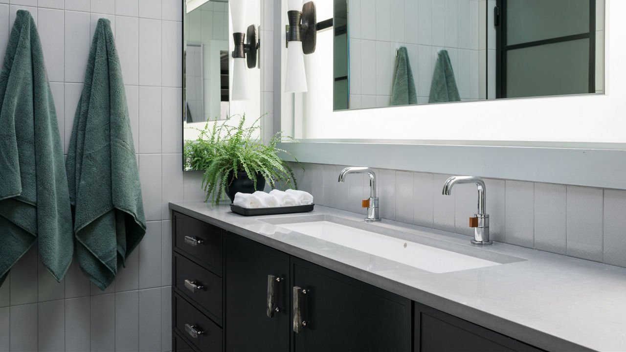 Elegant modern bathroom with quartz vanity countertop in spa-like setting